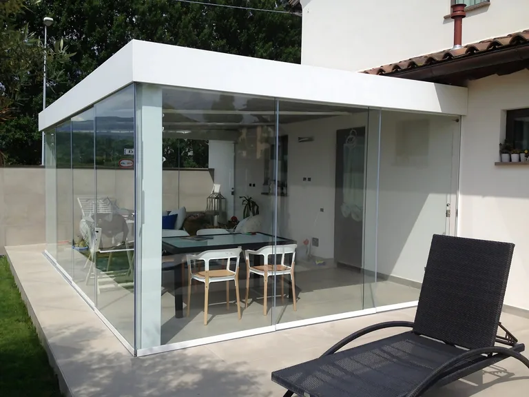 Residential sliding glass patio enclosure with dining area