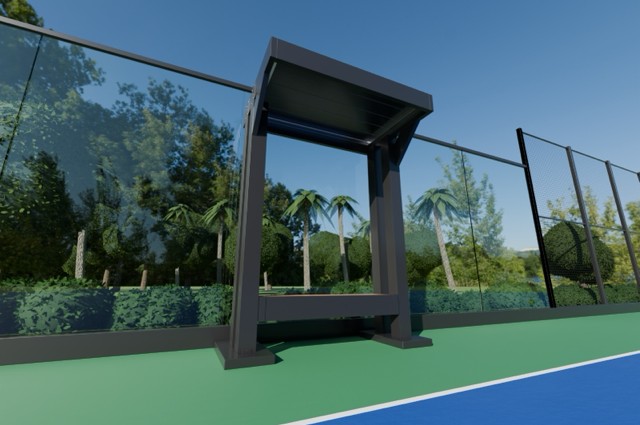 Eye-level view of a courtside bench canopy with a cantilevered louvered roof beside a glass-walled racquet court.